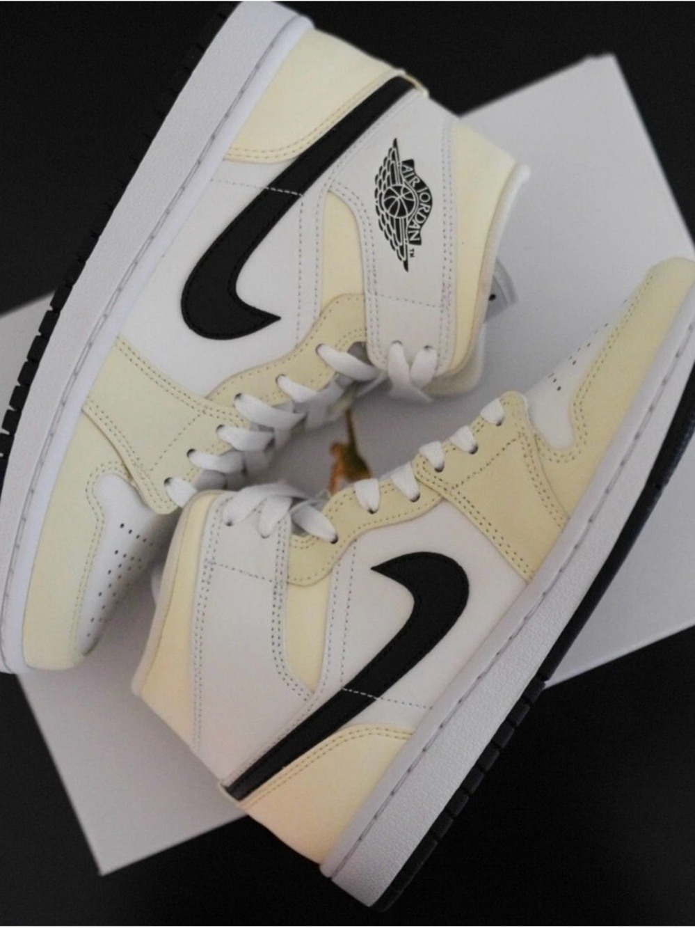 Nike Air Jordan 1 Mid color Coconut Milk/ Summit White with black swoosh